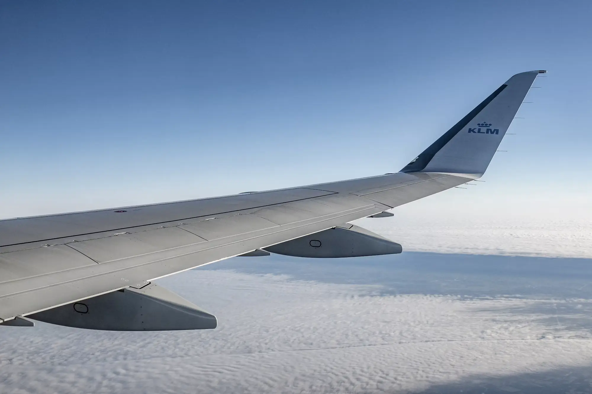 Airplane wing above the clouds